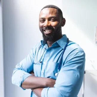 Portrait of happy african american male doctor wea 2026 03 25 02 44 19 utc