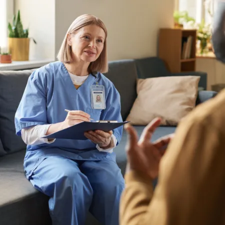 Woman nurse takes notes in a home setting 2026 01 09 00 44 37 utc